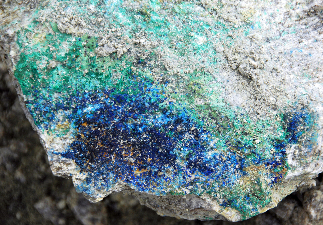 Azurite-malachite in quartz monzonite, an indicator of possible copper deposits.