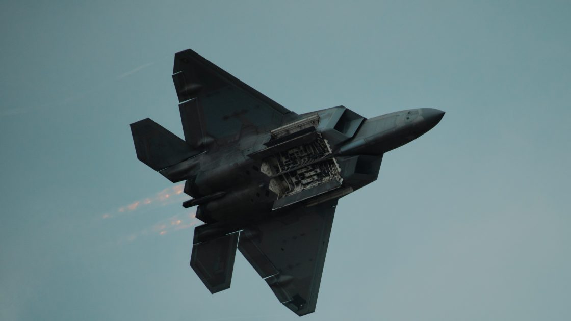 An F-22 Raptor shows off its weapons bay at EAA AirVenture Oshkosh 2026 to depict the US Defence