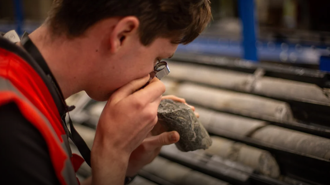 Aquitaine worker analysing drill core sample
